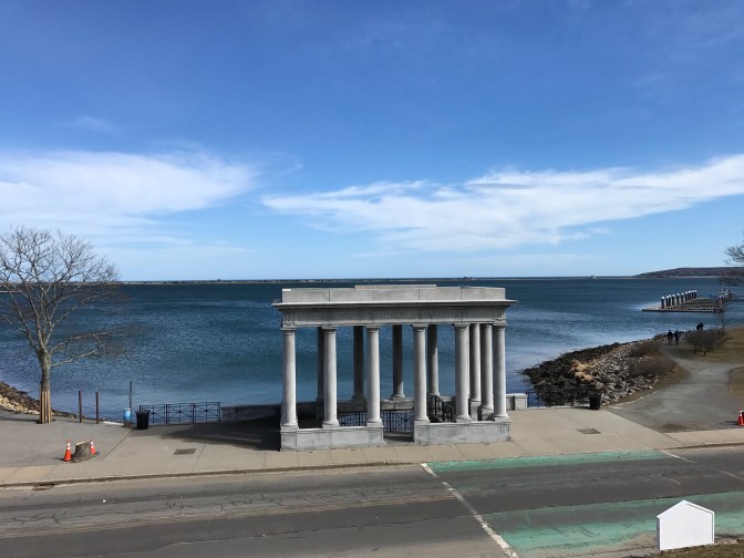 Portico of Plymouth Rock with the Massachusetts Bay in the background.