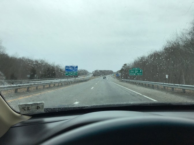 Image of I-95 in the rain, through a car windshield.