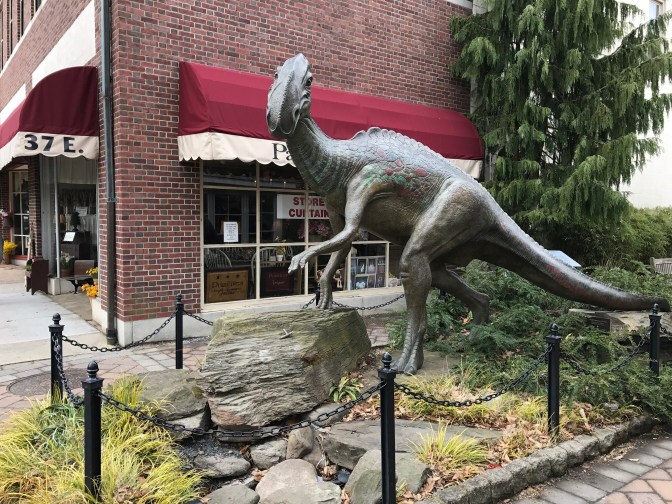 Dinosaur statue along sidewalk in Haddonfield.