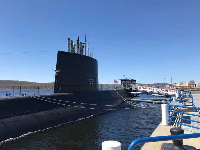 Photo of the USS Nautilus submarine, tied to its pier.