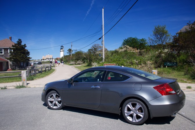 Honda Accord in foreground, Highland Lighthouse in background.