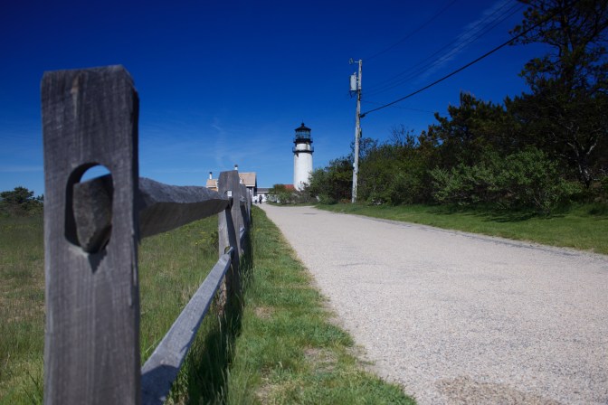 Fence in foreground, Highland Light in background.