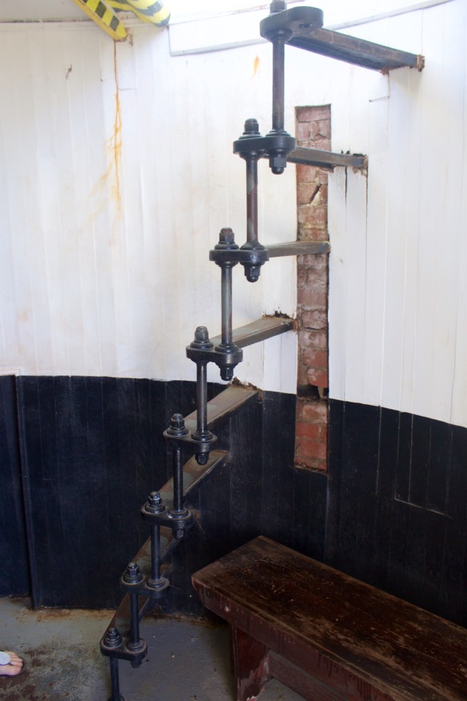 Metal staircase to top of lighthouse.