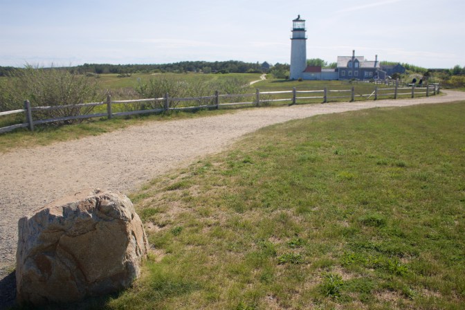 Marker rock in foreground, lighthouse in background.