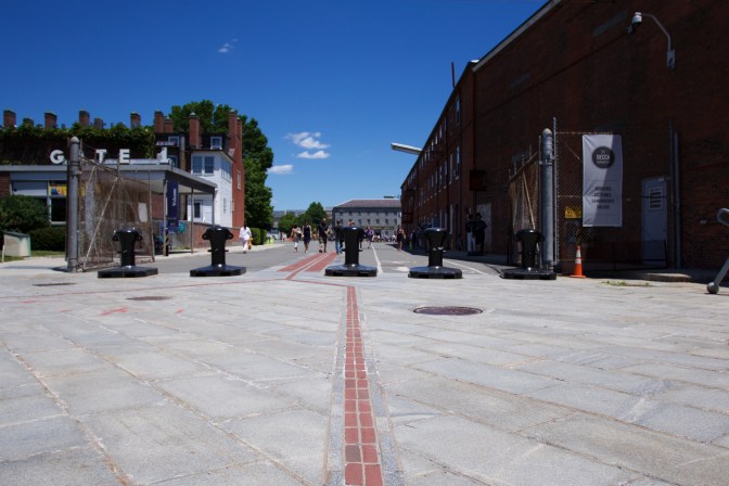 Red brick path of Freedom Trail leading to Boston Navy Yard.