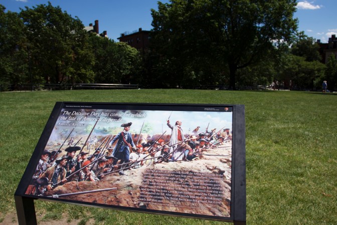 Sign in front of the monument, commemorating the battle.