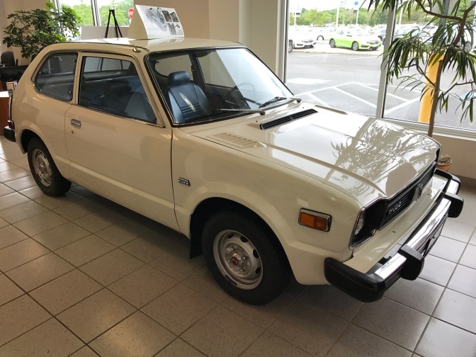 1978 Honda Civic on dealer showroom floor.
