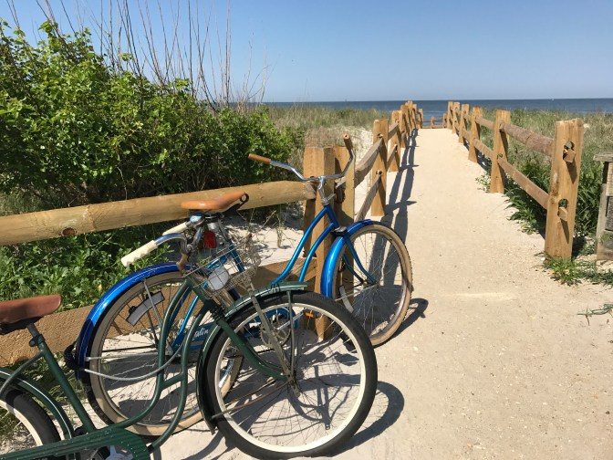 Path to beach, with bicycles in the foreground.