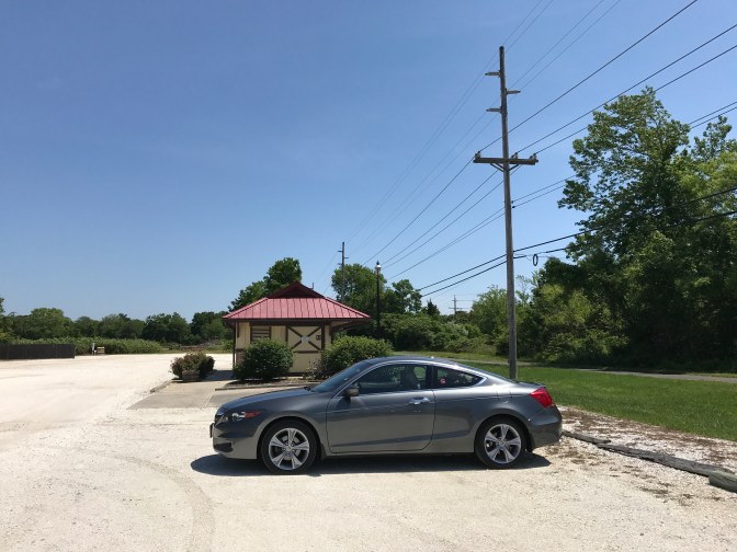 2012 Honda Accord in gravel parking lot.