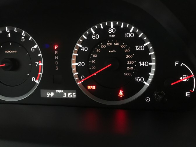 View of odometer and center gauges on 2012 Honda Accord.
