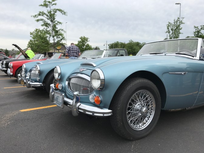 Four Austin Healey 3000 cars.