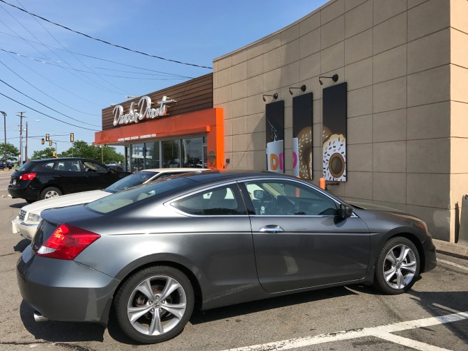 Honda Accord in front of Dunkin Donuts store.