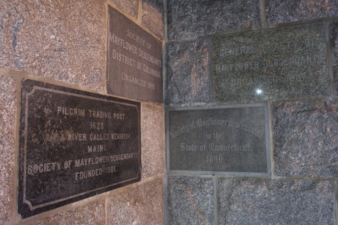 Stone engraved tablets on the walls from different organizations that donated to the construction of the monument.