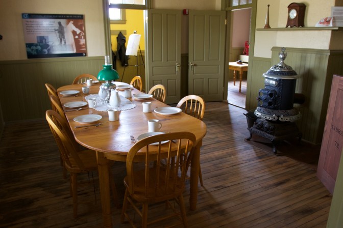 Dining room, with a table set for 8 people.