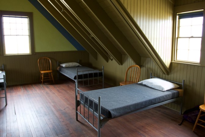 Bunks and chairs in the bedroom for the staff.
