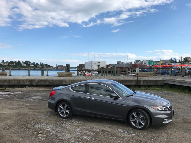 2012 Honda Accord in front of docks in Gloucester.