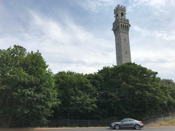 2012 Honda Accord in foreground, trees, and then Pilgrim Monument in the background.