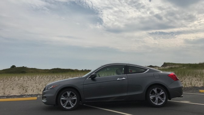 2012 Honda Accord coupe in front of sand dunes.