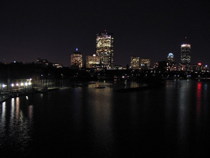 Nighttime view of the Boston skyline.