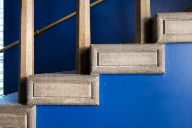 Stone stairs with blue walls.