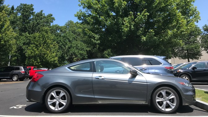 2012 Honda Accord in gray, parked in a parking lot.