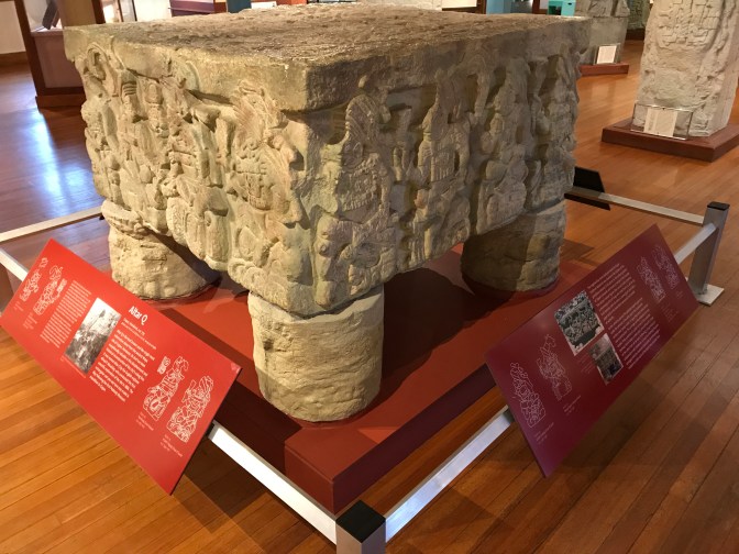 Altar Q, a square shaped alter with carved imagery.