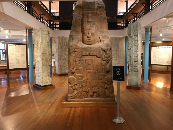 Exhibit on Central American temples. Several stone altars are in the photograph.