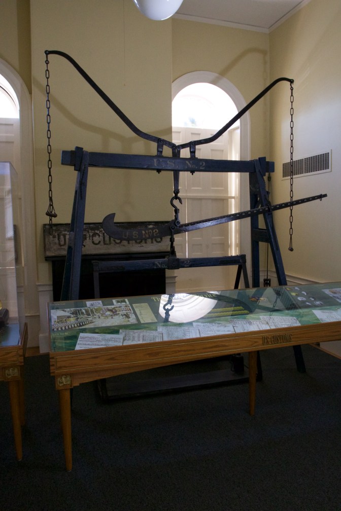 Large iron scale inside the Custom House.