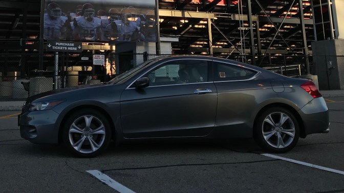 2012 Honda Accord parked in front of football stadium.