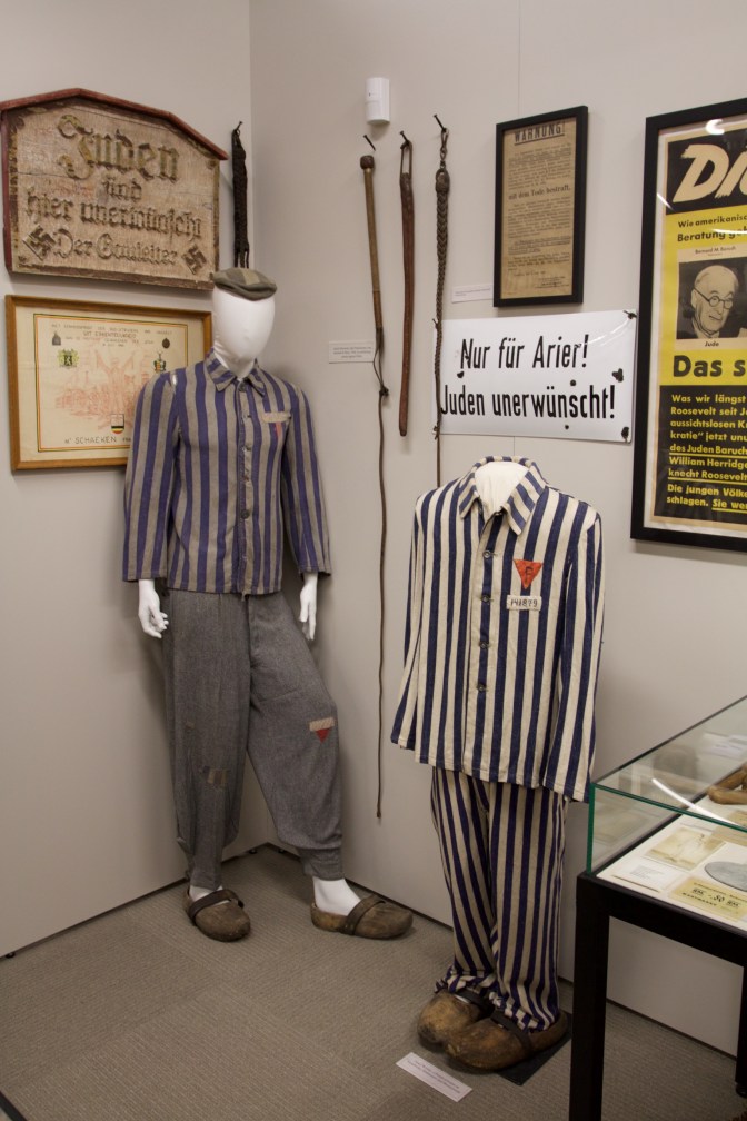 Exhibit on the Holocaust, including prisoners uniforms.