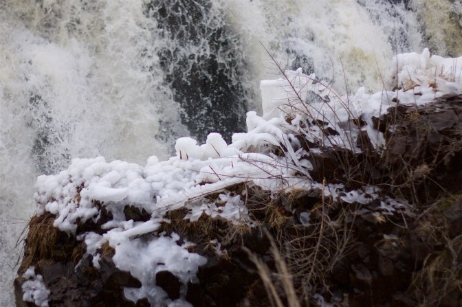 Ice formations on the rock face across from the falls.