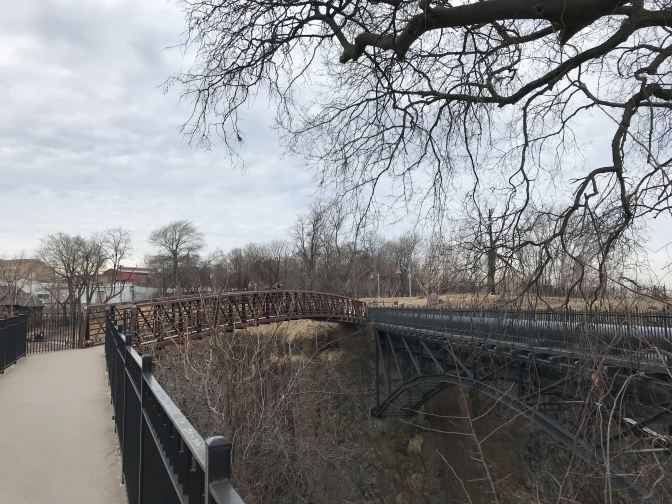 View of path and footbridge over gorge.