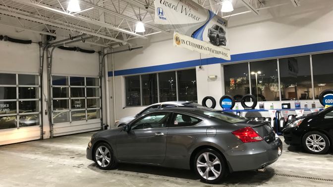 2012 Honda Accord in Honda dealership garage.