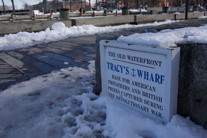 Sign that reads: "The Old waterfront. Tracy's Wharf: Base for American Privateers and British Prizes Captured During the Revolutionary War."
