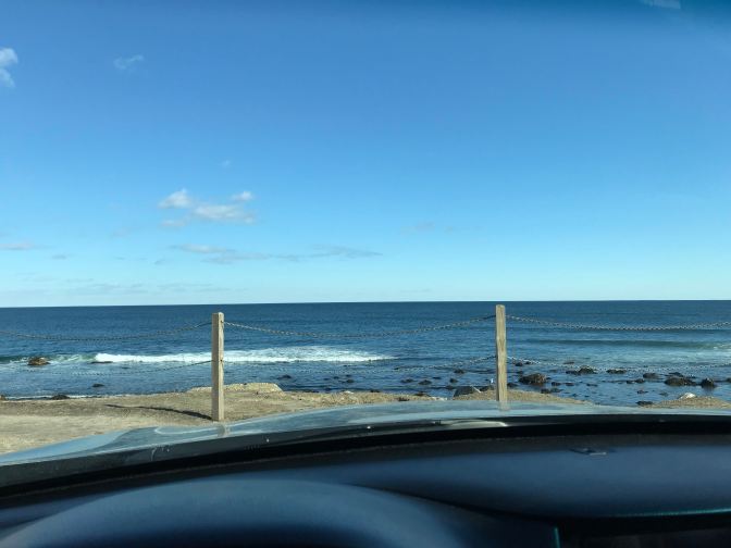 View of Narragansett Bay from behind the wheel of a car.
