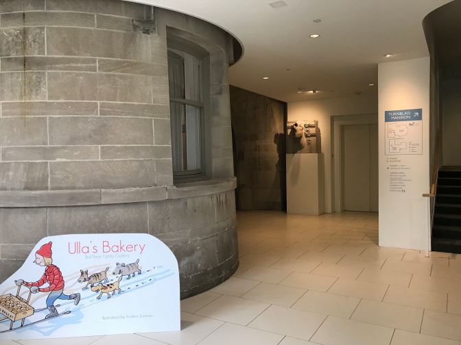 Entrance to the Turnblad Mansion, with the exterior of a portion of the mansion surrounded by the newer museum.