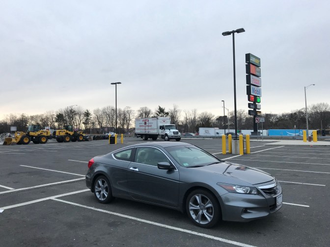 2012 Honda Accord parked in empty parking lot.