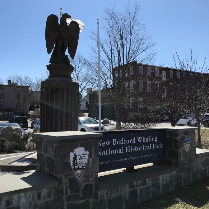 Stone monument entrance to New Bedford Whaling National Historic Park.
