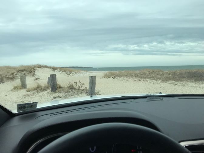 View of the Atlantic Ocean through the windshield of a car.
