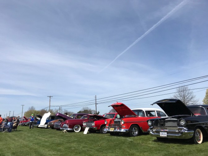Line of cars at a car show.