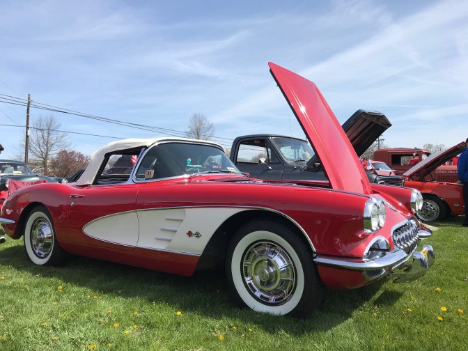 First generation red and white Chevrolet Corvette.