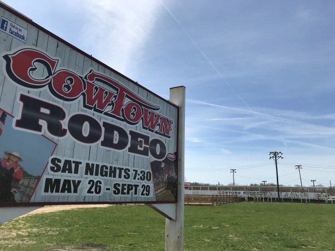 Roadside sign for Cowtown Rodeo.