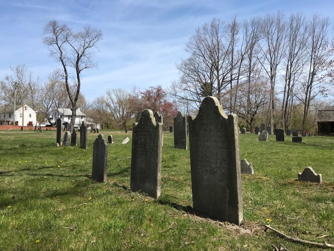 Cemetery outside of the church, headstones in the foreground.