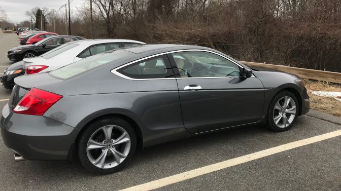 2012 Honda Accord EX-L V6 coupe, parked in a parking lot.