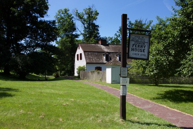 Johnson Ferry House. A sign in the foreground says STATE OF NEW JERSEY HISTORIC SITE - JOHNSOn FERRY HOUSE CIRCA 1740.