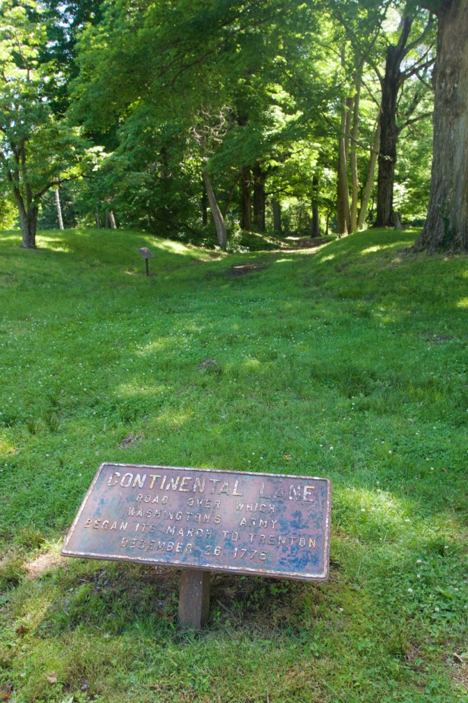 Entrance to Continental Lane. Sign on the ground says CONTINENTAL LANE - Road per which Washington's Army Began Its March to Trenton December 26, 1776.