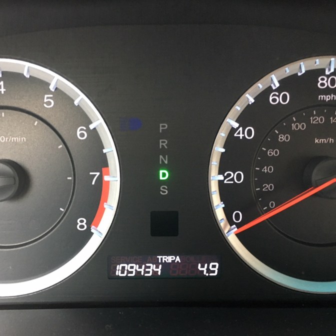 Car odometer reading 109434 miles.