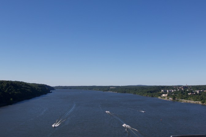 Northward view of the Hudson River, with several small craft on the water.