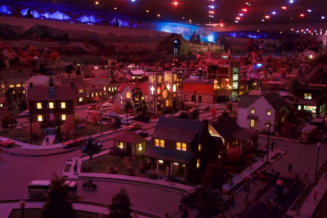 Diorama in low-light with buildings lit during the Night Pageant.