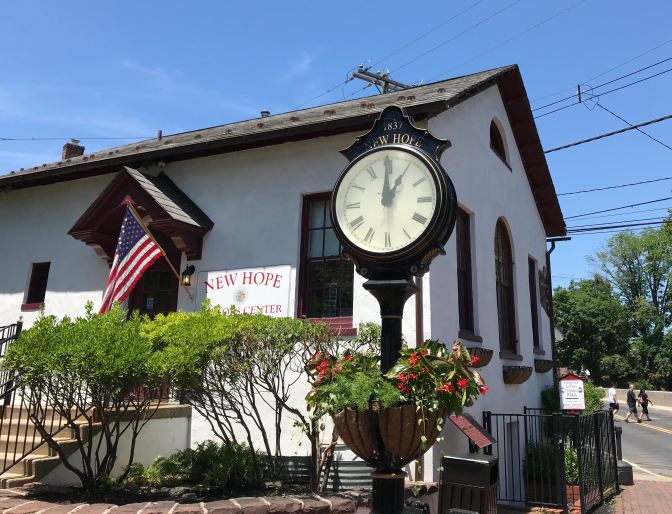 New Hope Visitors Center, with a large clock in front of the building.